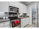 Well-lit kitchen with stainless steel appliances, ample counter space, and white cabinetry at 163 Golfview Ln, Summerville, SC 29485