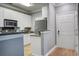 Bright kitchen with white cabinets, stainless steel appliances, and an open layout to the front door at 163 Golfview Ln, Summerville, SC 29485