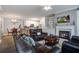 Inviting open-concept living room flows into the dining area and kitchen, with a fireplace feature at 163 Golfview Ln, Summerville, SC 29485
