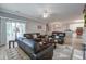 Spacious living area showcasing hardwood floors, a cozy fireplace, and an adjacent dining area at 163 Golfview Ln, Summerville, SC 29485