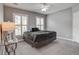 Bedroom features neutral gray walls, carpeting, ceiling fan, and large windows for natural light at 163 Golfview Ln, Summerville, SC 29485