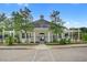 A lovely pool house is surrounded by greenery and offers a shady retreat at 163 Golfview Ln, Summerville, SC 29485