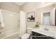 Clean bathroom features a shower-tub combination with a white curtain, vanity, and neutral color scheme at 167 Surfbird Rd # 649P, Summerville, SC 29486