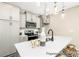 Modern kitchen features sleek white quartz countertops, gray cabinets, and stainless steel appliances at 167 Surfbird Rd # 649P, Summerville, SC 29486
