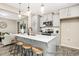 Well-designed kitchen island with pendant lights, stainless steel appliances, gray cabinetry, and open to the living area at 167 Surfbird Rd # 649P, Summerville, SC 29486