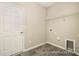 Practical laundry room with wood look flooring and equipped with dryer hookup, wire shelving and a utility sink at 167 Surfbird Rd # 649P, Summerville, SC 29486