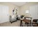 Inviting seating area with two armchairs, a lamp, books, and an abstract art piece to make this room cozy at 167 Surfbird Rd # 649P, Summerville, SC 29486