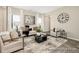 Inviting living room features a stylish area rug, comfortable seating, bright windows, and contemporary decor at 167 Surfbird Rd # 649P, Summerville, SC 29486