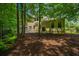 Backyard with a patio, lush trees, and the home's exterior at 1721 Wellstead St, Mount Pleasant, SC 29466