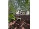Serene backyard featuring a stone bench amidst lush greenery, providing a peaceful retreat at 1721 Wellstead St, Mount Pleasant, SC 29466