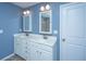 Bathroom featuring a dual sink vanity, a well-lit mirror, and a glass shower at 1721 Wellstead St, Mount Pleasant, SC 29466