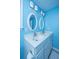 Bathroom with double sink vanity, oval mirrors, and light fixtures at 1721 Wellstead St, Mount Pleasant, SC 29466