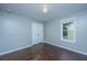 Bedroom featuring a light fixture, wood floors, and a closet with white doors at 1721 Wellstead St, Mount Pleasant, SC 29466