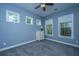 Bright bedroom featuring three windows, neutral walls, and plush carpet at 1721 Wellstead St, Mount Pleasant, SC 29466