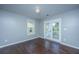Well-lit bedroom with hardwood floors, and french doors at 1721 Wellstead St, Mount Pleasant, SC 29466