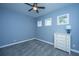 Cozy bedroom boasts soft carpet and natural light from two windows at 1721 Wellstead St, Mount Pleasant, SC 29466