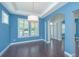 Open dining room area with hardwood floors, tray ceilings, and plantation shutters at 1721 Wellstead St, Mount Pleasant, SC 29466