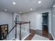 Upstairs hallway with wood floors, staircase and multiple doorways at 1721 Wellstead St, Mount Pleasant, SC 29466