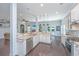 Bright, open kitchen featuring granite countertops, stainless steel appliances, and hardwood floors at 1721 Wellstead St, Mount Pleasant, SC 29466