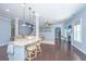 Open concept kitchen with an island, pendant lighting, and clear view into the living area with a fireplace at 1721 Wellstead St, Mount Pleasant, SC 29466