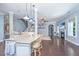 Open concept kitchen with granite island, pendant lighting, and clear view into the living area with fireplace at 1721 Wellstead St, Mount Pleasant, SC 29466