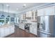 Modern kitchen featuring stainless steel appliances, white cabinets, and granite countertops at 1721 Wellstead St, Mount Pleasant, SC 29466