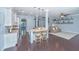 Modern kitchen featuring granite countertops, island seating, stainless steel appliances, and dark hardwood floors at 1721 Wellstead St, Mount Pleasant, SC 29466