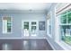 Sunlit room featuring two bright windows and french doors leading to a yard at 1721 Wellstead St, Mount Pleasant, SC 29466