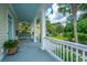Inviting front porch featuring a swing, ceiling fan, and views of the landscaped yard at 1721 Wellstead St, Mount Pleasant, SC 29466