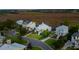 Aerial view of several homes in a neighborhood surrounded by marsh and natural landscaping at 1809 Rushland Grove Ln, Johns Island, SC 29455