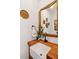 Charming powder room with a farmhouse sink, rustic wood accents, and unique decor at 1809 Rushland Grove Ln, Johns Island, SC 29455