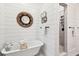Bright bathroom featuring a claw foot bathtub and modern tiled shower at 1809 Rushland Grove Ln, Johns Island, SC 29455