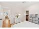 Bright, tidy bedroom with a white dresser, decor and open closet space at 1809 Rushland Grove Ln, Johns Island, SC 29455