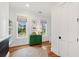 Bright room with hardwood floors, colorful shades, and a green cabinet at 1809 Rushland Grove Ln, Johns Island, SC 29455