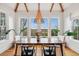 Bright dining room featuring a wooden table, stylish decor, lots of natural light, and picturesque views at 1809 Rushland Grove Ln, Johns Island, SC 29455