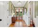 Elegant entryway with hardwood floors, wainscoting, and a stylish chandelier at 1809 Rushland Grove Ln, Johns Island, SC 29455