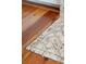 Close-up of the flooring displaying hardwood floors, a brick fireplace, and a beautiful design aesthetic at 1809 Rushland Grove Ln, Johns Island, SC 29455