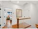 Hallway featuring hardwood floors leading to bedrooms with ample light at 1809 Rushland Grove Ln, Johns Island, SC 29455