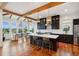 Bright kitchen featuring black cabinets, a center island with seating, and stainless steel appliances at 1809 Rushland Grove Ln, Johns Island, SC 29455