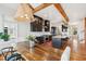 Open-concept kitchen with an island, a dining table, stylish black cabinets, and stainless steel appliances at 1809 Rushland Grove Ln, Johns Island, SC 29455