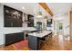 Modern kitchen with black cabinets, white countertops, and seating at the island at 1809 Rushland Grove Ln, Johns Island, SC 29455