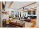 Open-concept living room with hardwood floors, shiplap walls, and backyard views at 1809 Rushland Grove Ln, Johns Island, SC 29455