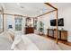 Bright and airy main bedroom with hard wood floors and a four-poster bed at 1809 Rushland Grove Ln, Johns Island, SC 29455