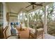Inviting outdoor porch with marsh views, fan, and comfortable seating area at 1809 Rushland Grove Ln, Johns Island, SC 29455