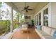 Inviting porch with marsh views and dining table at 1809 Rushland Grove Ln, Johns Island, SC 29455