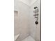 Modern bathroom shower featuring light tile, black showerhead and cubby at 1809 Rushland Grove Ln, Johns Island, SC 29455