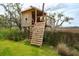 Charming treehouse with climbing holds, providing a fun and adventurous play area in the backyard at 1809 Rushland Grove Ln, Johns Island, SC 29455