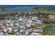 Vast aerial shot showcases a large neighborhood with waterfront views, mature trees, and a community pool at 1903 Bolden Dr, Mount Pleasant, SC 29466