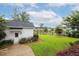 Spacious backyard with lush green lawn, garden and white building at 1903 Bolden Dr, Mount Pleasant, SC 29466