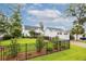 Large, fenced backyard showcasing landscaping and detached garage at 1903 Bolden Dr, Mount Pleasant, SC 29466